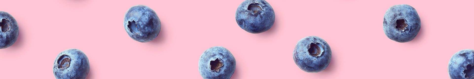Blueberries on pink background