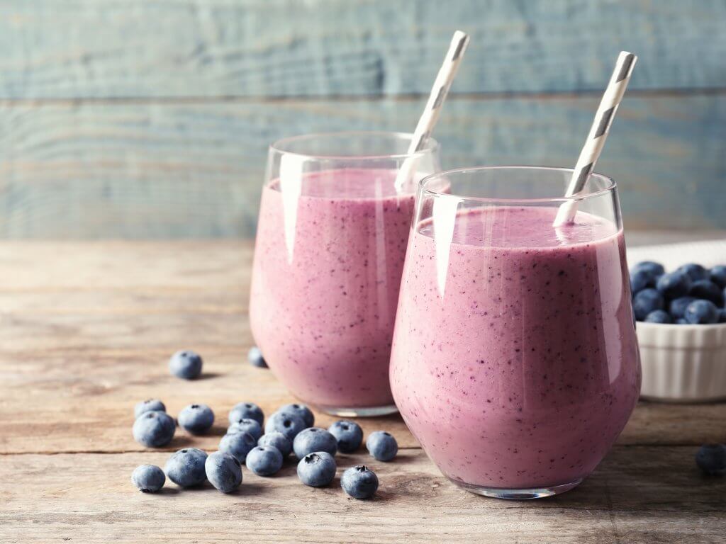 Two glasses of blueberry smoothie