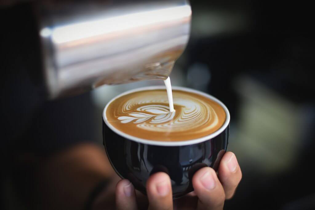 Barista making a latte