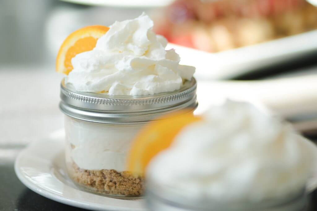 Citrus cheesecake with whipped cream on top