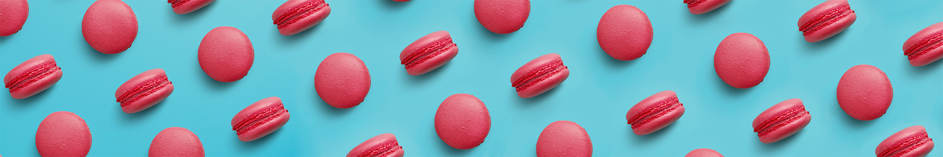 Red macarons against a blue background