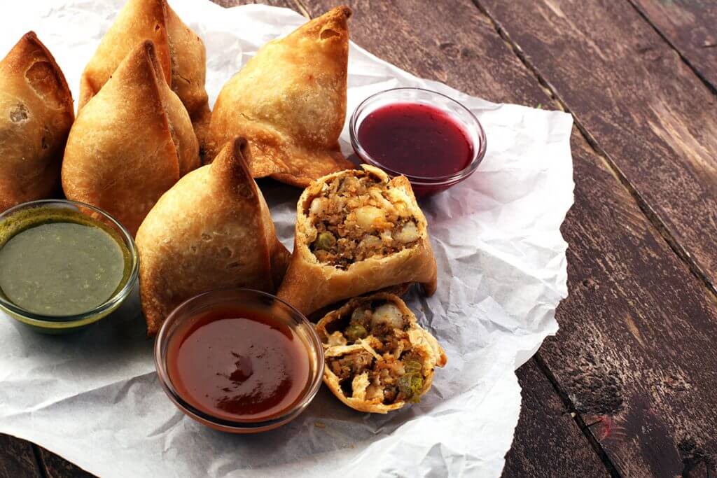 Samosas served with sauces
