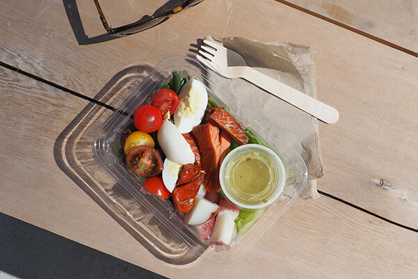 Salad in a plastic to-go container