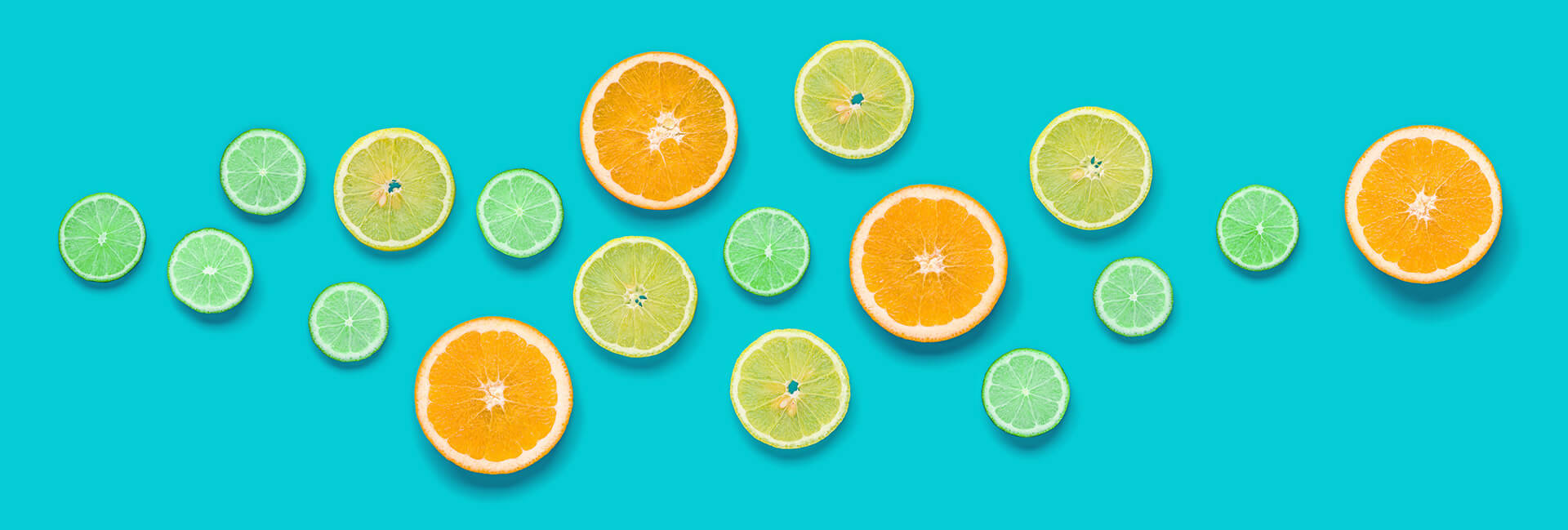Citrus fruits against a blue-green background